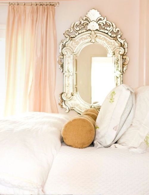 Baroque mirror in soft pink bedroom